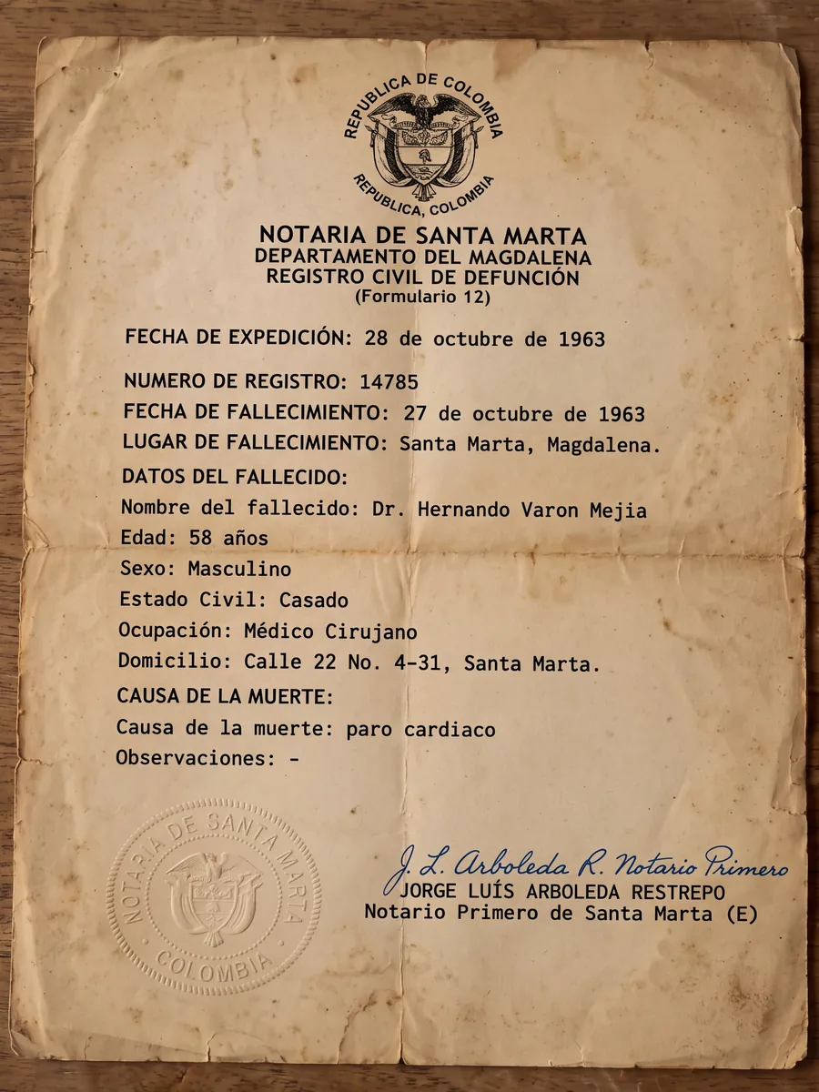 Official death certificate from the Notary of Santa Marta, dated 28 October 1963, with dry seals and the notary&rsquo;s signature. Cause of death: cardiac arrest.